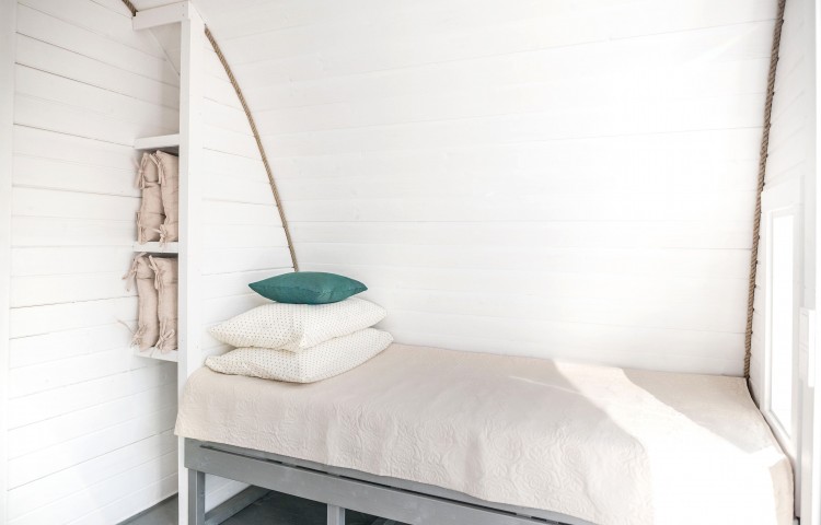 Single Bed and Shelves in insulated glamping pod 3.2 x 5.9